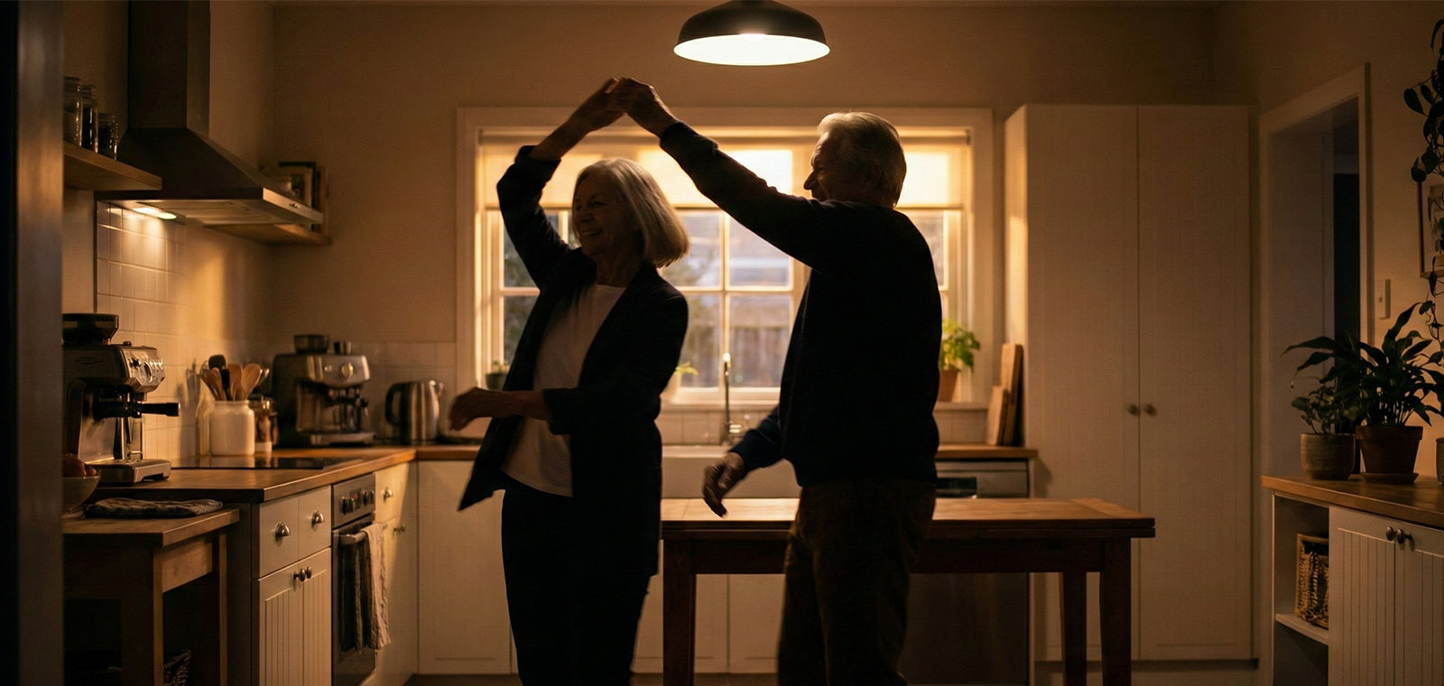 Kitchen dancing silhouette, emotional payoff moment